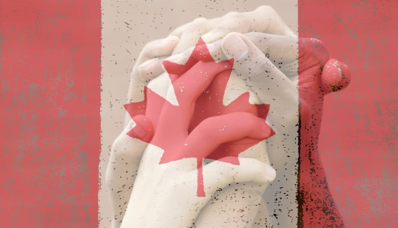 Multicultural group of hands and Canadian flag